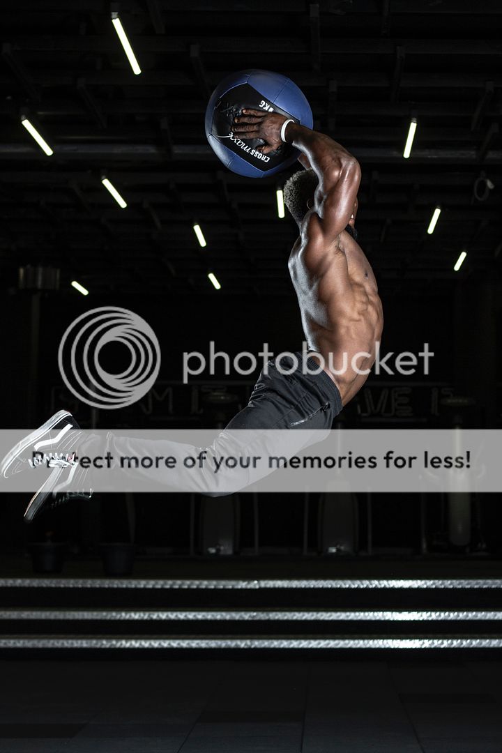 man jumping with exercise ball